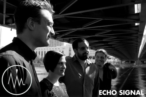 Black and white portrait of Adam, Rachel, Ben, and Phaedrus (Echo Signal in 2014) beneath a bridge in Minneapolis.